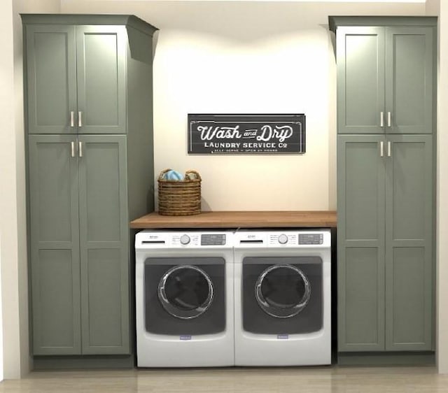 laundry room featuring cabinets and independent washer and dryer