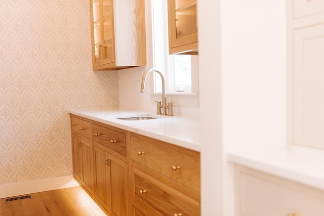 kitchen with sink and light wood-type flooring