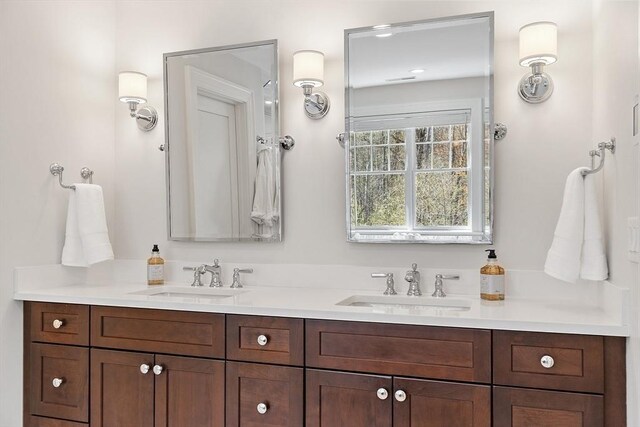 full bath featuring double vanity and a sink