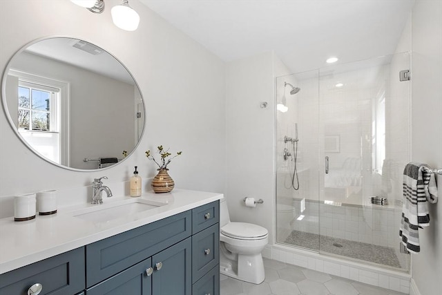 bathroom with tile patterned flooring, vanity, toilet, recessed lighting, and a stall shower