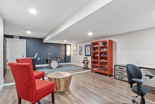 office area with recessed lighting, baseboards, visible vents, and wood finished floors