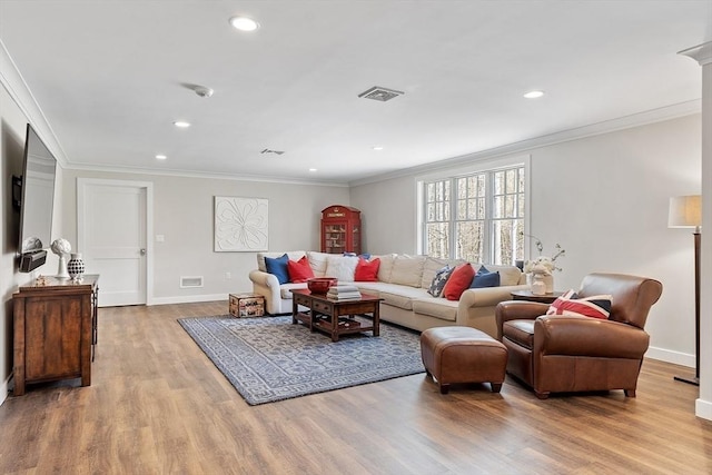 living room with baseboards, recessed lighting, wood finished floors, and visible vents