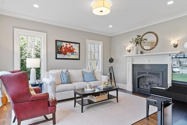 living room with crown molding, recessed lighting, and a wealth of natural light