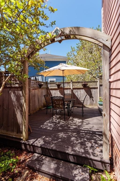 wooden terrace with fence and outdoor dining area