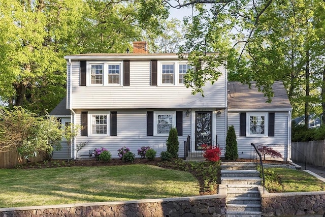 colonial home featuring a chimney