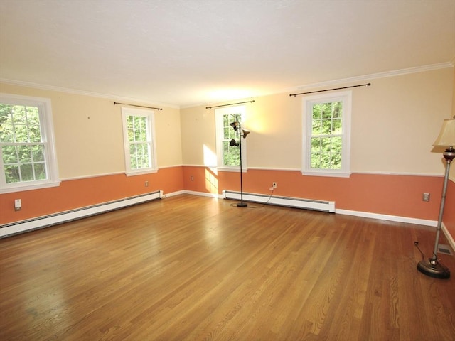 14 Oak Cir, Princeton, MA 01541 - spare room with a baseboard radiator, wood finished floors, healthy amount of natural light, and crown molding