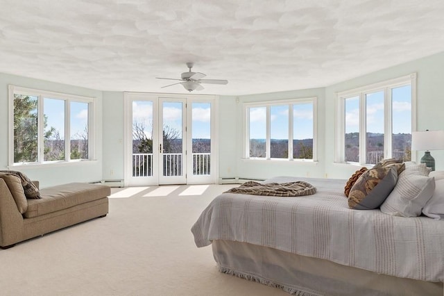 3 Longview Ter, Gloucester, MA 01930 - bedroom with access to outside, a baseboard radiator, carpet, a baseboard heating unit, and ceiling fan