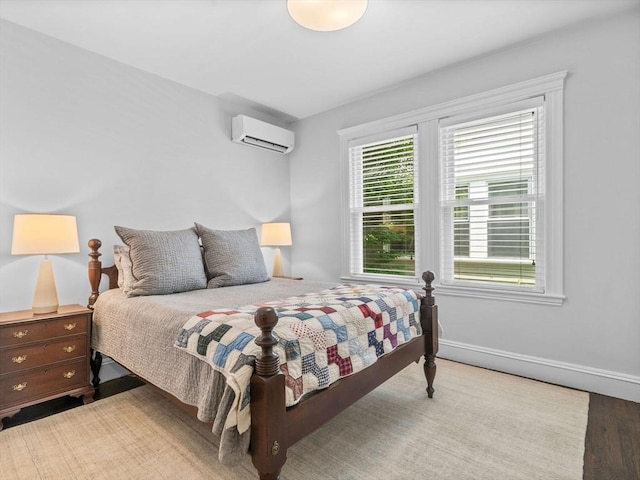 9 Sedgwick St Unit 1, Boston, MA 02130 - bedroom with a wall mounted air conditioner and wood finished floors