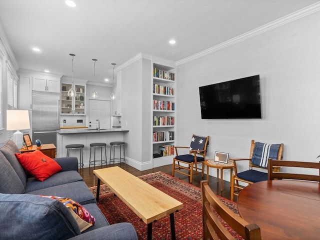 9 Sedgwick St Unit 1, Boston, MA 02130 - living area featuring dark wood-style floors, recessed lighting, crown molding, and built in shelves