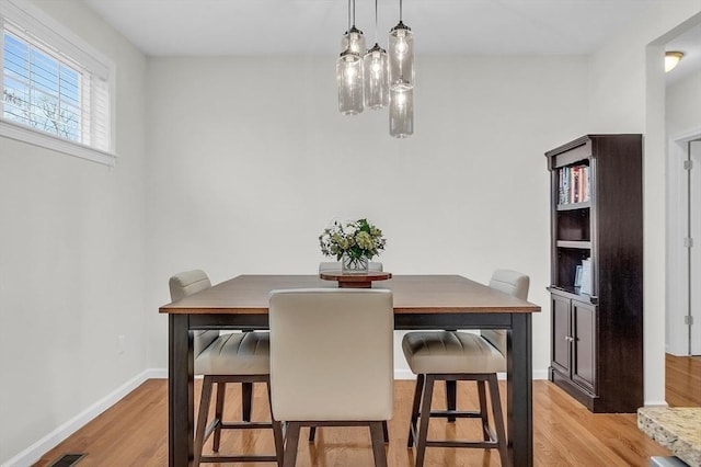 dining space featuring light hardwood / wood-style flooring