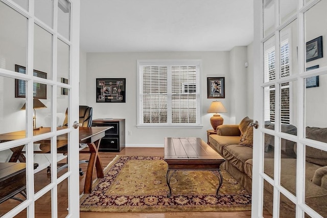 interior space with french doors and wood-type flooring