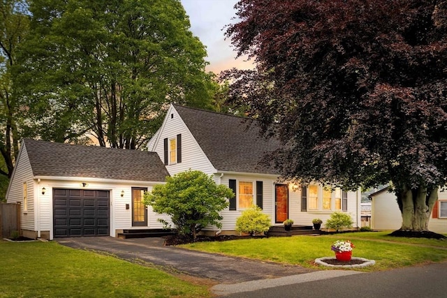 16 Hart Pl, Woburn, MA 01801 - view of front of home featuring a garage, driveway, a front yard, and a shingled roof