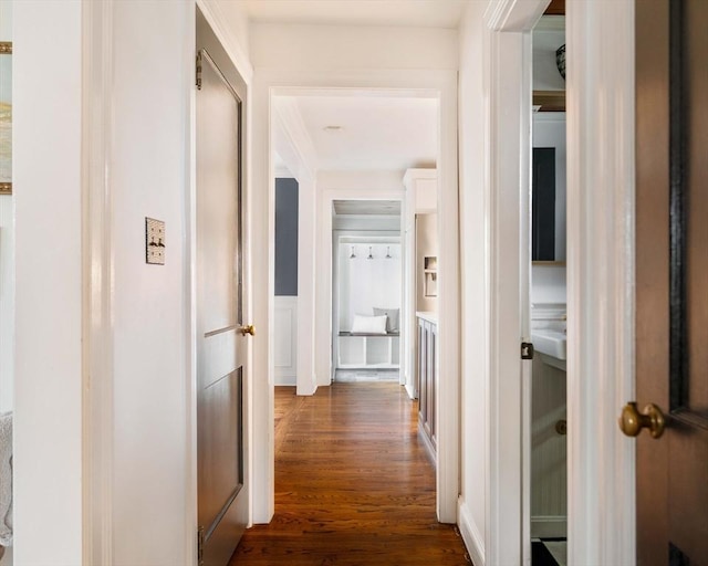 16 Hart Pl, Woburn, MA 01801 - hall with dark wood-type flooring, a wainscoted wall, and a decorative wall