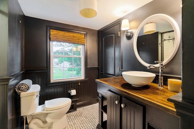 16 Hart Pl, Woburn, MA 01801 - bathroom featuring vanity, wainscoting, and a decorative wall