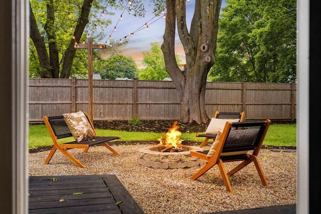 16 Hart Pl, Woburn, MA 01801 - fenced backyard with an outdoor fire pit