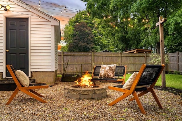 16 Hart Pl, Woburn, MA 01801 - fenced backyard with a fire pit and an outbuilding
