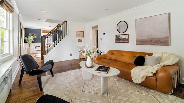 16 Hart Pl, Woburn, MA 01801 - living room featuring radiator heating unit, wood finished floors, stairway, and ornamental molding