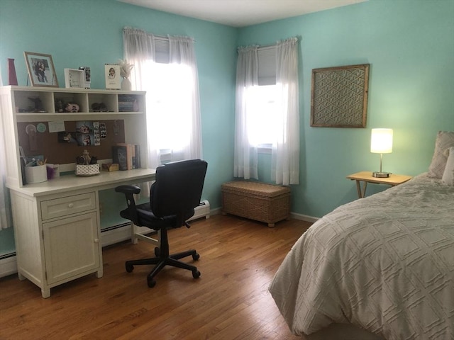 bedroom featuring light wood-type flooring and baseboards