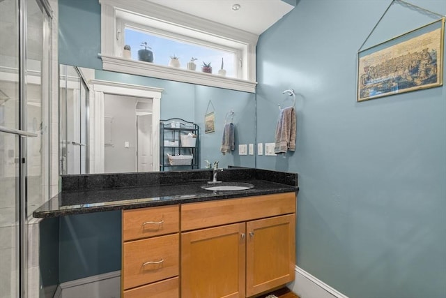 bathroom with vanity and a shower stall
