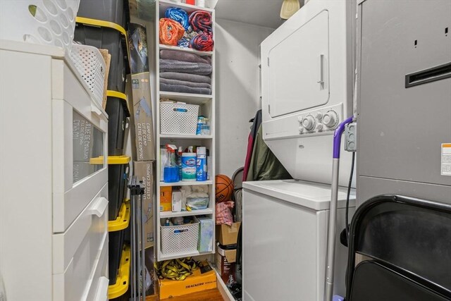 washroom with stacked washer and clothes dryer