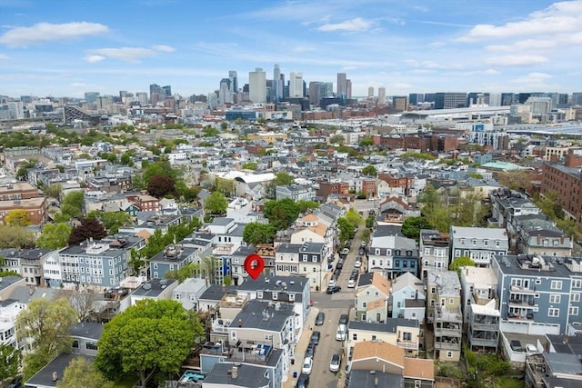 aerial view of property's location featuring a skyline view