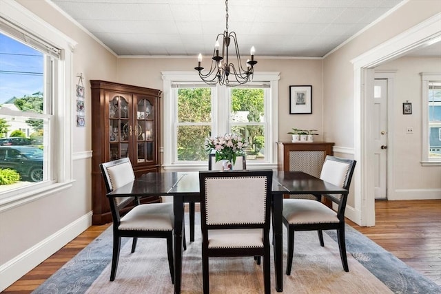 33 Lowell Ave, Watertown, MA 02472 - dining room with a chandelier, wood finished floors, baseboards, and ornamental molding