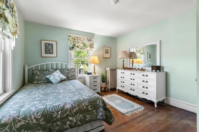33 Lowell Ave, Watertown, MA 02472 - bedroom featuring radiator, hardwood / wood-style flooring, multiple windows, and baseboards