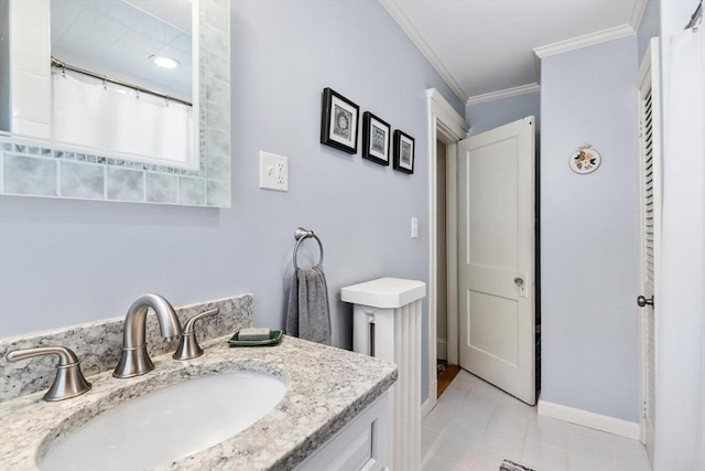 33 Lowell Ave, Watertown, MA 02472 - full bathroom featuring ornamental molding, vanity, baseboards, and tile patterned floors