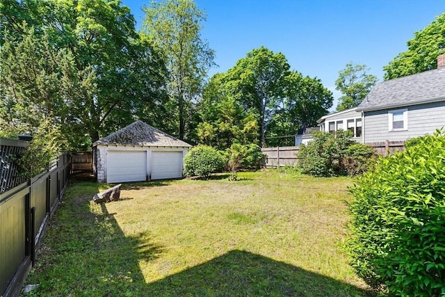 33 Lowell Ave, Watertown, MA 02472 - view of yard featuring a detached garage and an outbuilding
