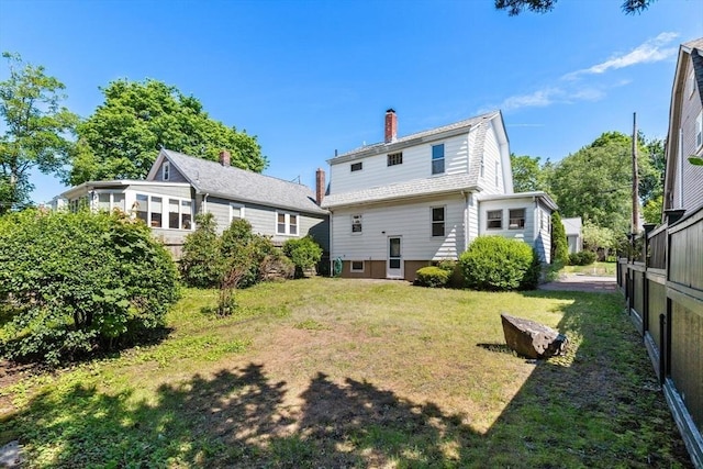 33 Lowell Ave, Watertown, MA 02472 - rear view of property with a gambrel roof and a chimney