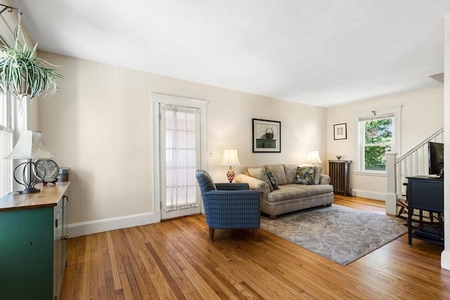 33 Lowell Ave, Watertown, MA 02472 - living room featuring hardwood / wood-style floors, baseboards, and stairs
