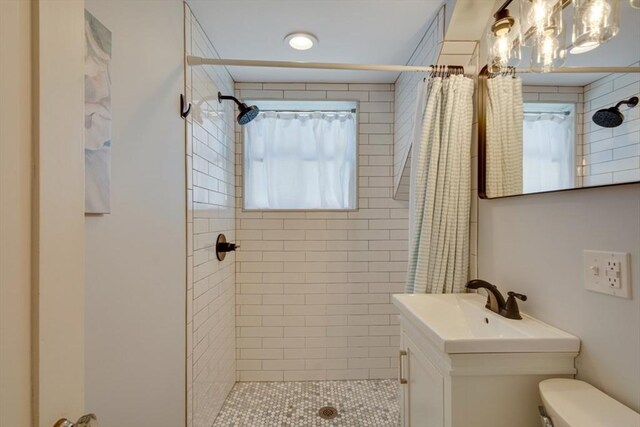 bathroom with vanity, toilet, and a shower with shower curtain