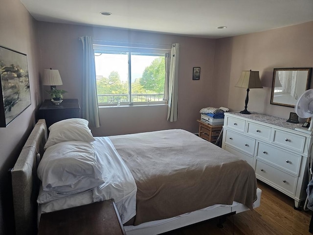 bedroom featuring dark wood finished floors