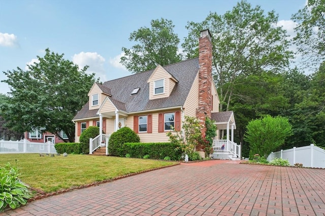 71 Constance Dr, Lowell, MA 01854 - new england style home featuring a chimney