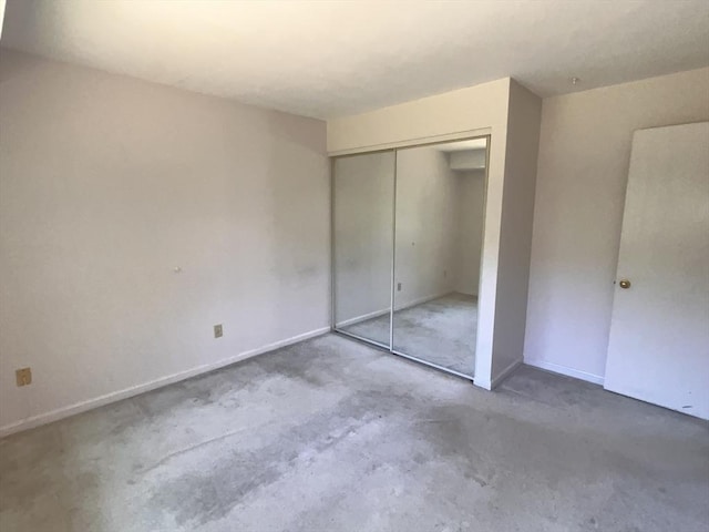 3 Bridgeview Cir Unit 55, Tyngsborough, MA 01879 - unfurnished bedroom featuring a closet and concrete floors