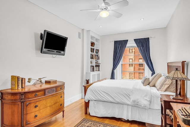 bedroom featuring light wood-type flooring and ceiling fan