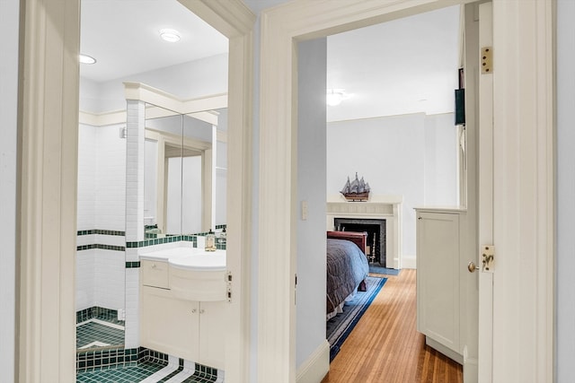 bathroom with vanity and hardwood / wood-style floors