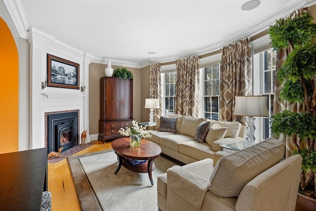 living room with ornamental molding and wood-type flooring