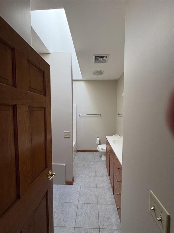 full bath featuring visible vents, tile patterned floors, baseboards, vanity, and toilet