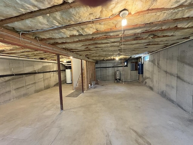 unfinished below grade area featuring gas water heater
