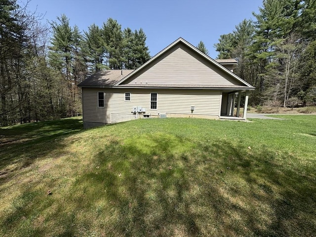 rear view of house with a yard