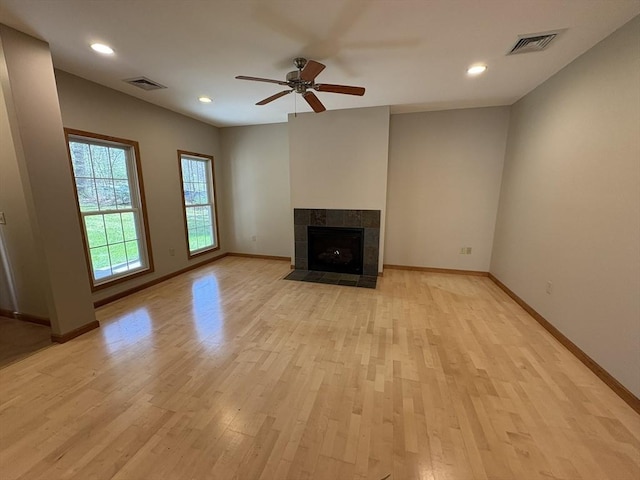 unfurnished living room featuring ceiling fan, light wood finished floors, and visible vents