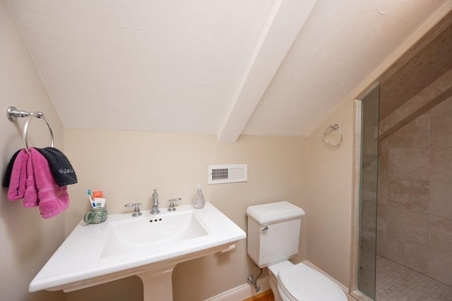 bathroom featuring toilet, a shower with door, sink, and vaulted ceiling with beams