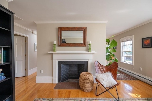 living room with baseboard heating, crown molding, and hardwood / wood-style floors