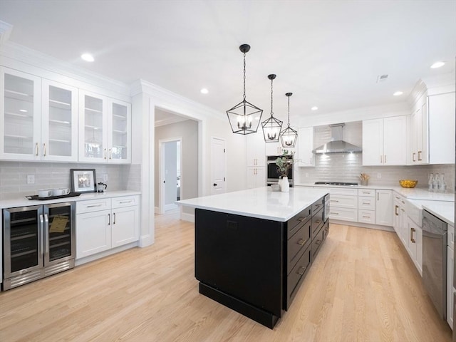 7 Brookdale Rd, Natick, MA 01760 - kitchen with wall chimney range hood, beverage cooler, white cabinetry, and light countertops
