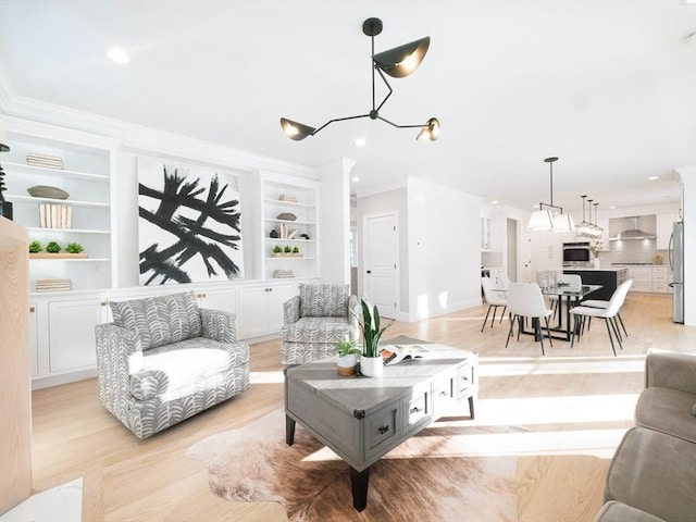 7 Brookdale Rd, Natick, MA 01760 - living room with crown molding, recessed lighting, a chandelier, and light wood-type flooring