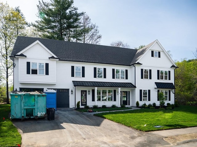 7 Brookdale Rd, Natick, MA 01760 - view of front of home featuring a standing seam roof, driveway, a front lawn, and a garage