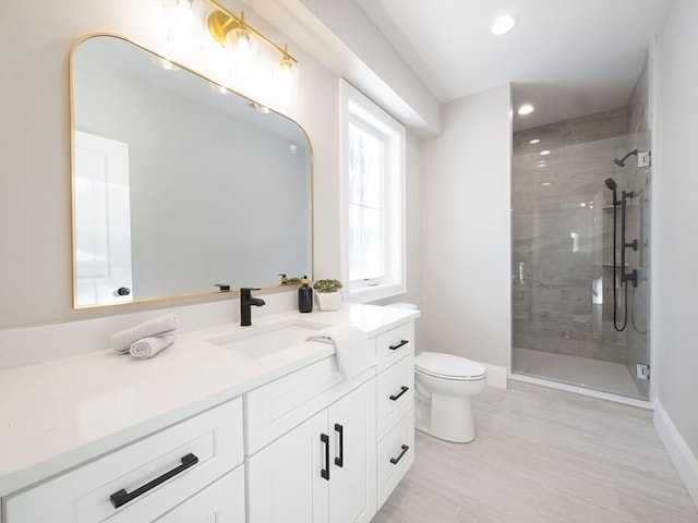 7 Brookdale Rd, Natick, MA 01760 - bathroom featuring vanity, toilet, recessed lighting, baseboards, and a shower stall