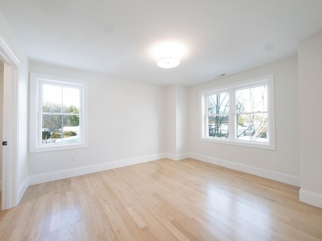 7 Brookdale Rd, Natick, MA 01760 - spare room with a healthy amount of sunlight, baseboards, and light wood finished floors
