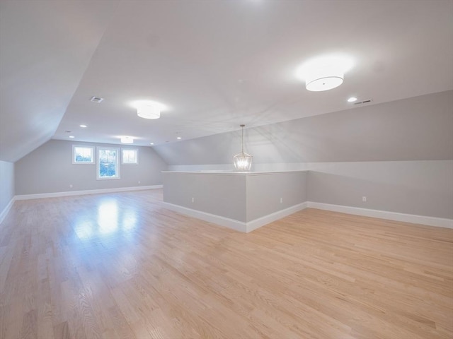 7 Brookdale Rd, Natick, MA 01760 - bonus room featuring baseboards, visible vents, light wood-type flooring, and lofted ceiling